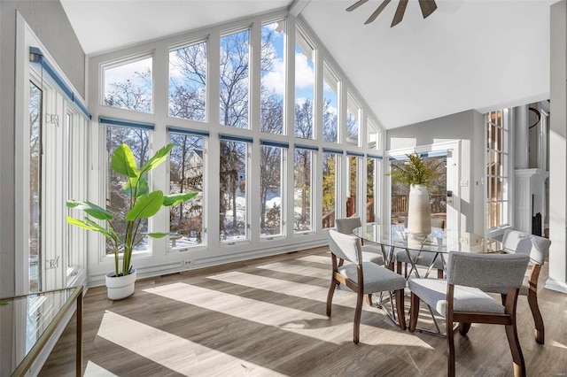 sunroom featuring ceiling fan and lofted ceiling