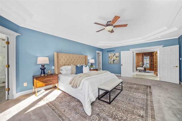 bedroom featuring ceiling fan, carpet, crown molding, and a raised ceiling