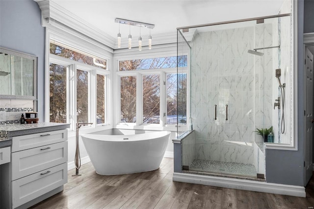 bathroom with vanity, separate shower and tub, and wood-type flooring