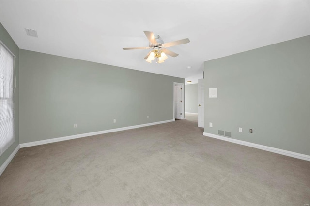 carpeted empty room featuring ceiling fan