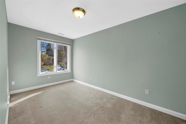 empty room with light colored carpet