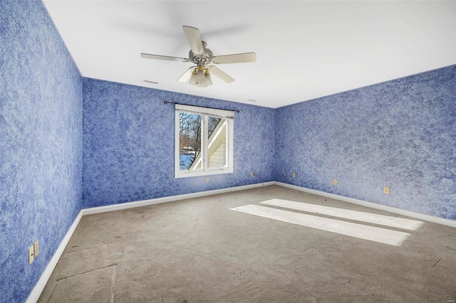 spare room with ceiling fan