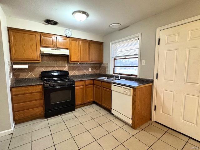 kitchen with dishwasher, sink, decorative backsplash, black gas range oven, and light tile patterned flooring