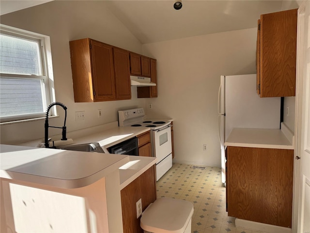 kitchen with kitchen peninsula, white appliances, lofted ceiling, and sink