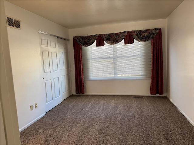 unfurnished room with carpet