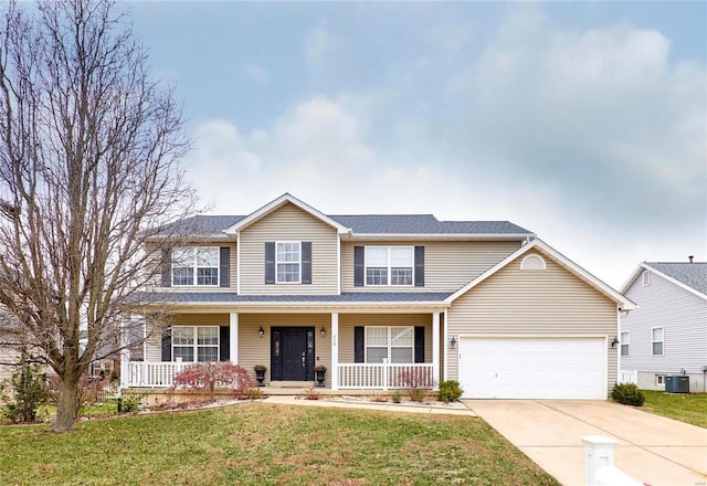 view of property with a porch, a garage, a front yard, and central AC