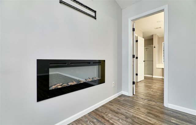 hallway with dark wood-type flooring