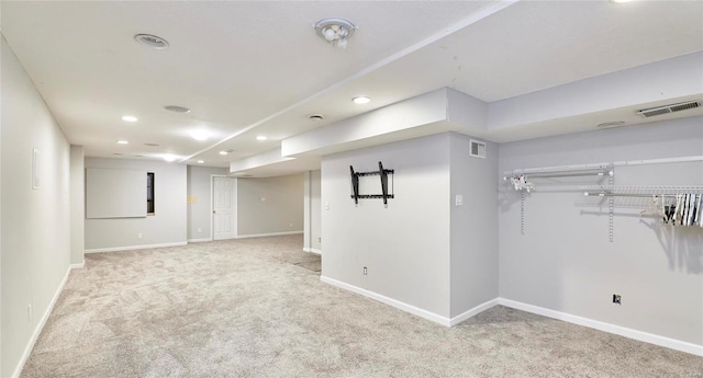 basement featuring light carpet