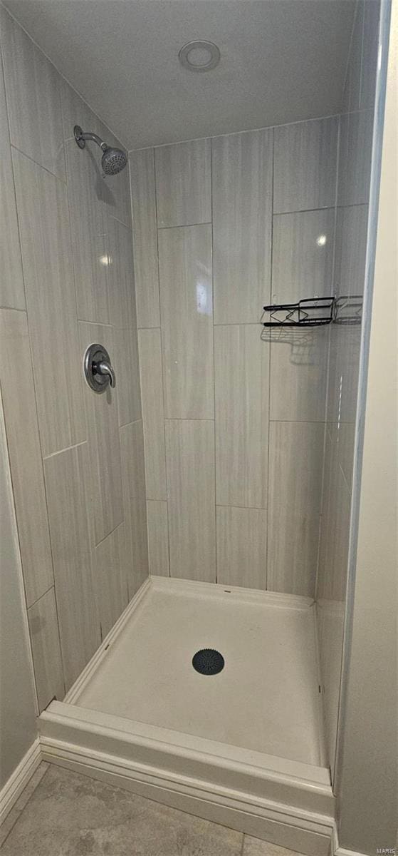 bathroom with tiled shower