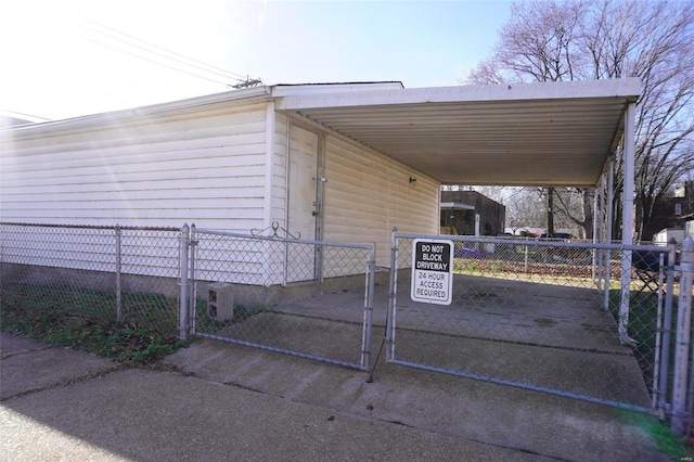 view of side of home with a carport