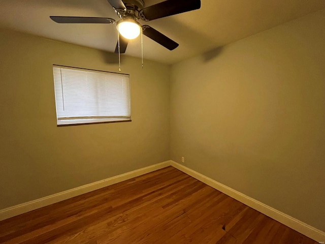 spare room with wood-type flooring and ceiling fan