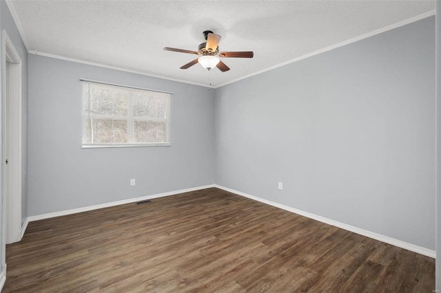 unfurnished room featuring dark hardwood / wood-style floors, ceiling fan, and crown molding