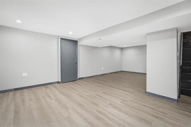 basement featuring light hardwood / wood-style floors