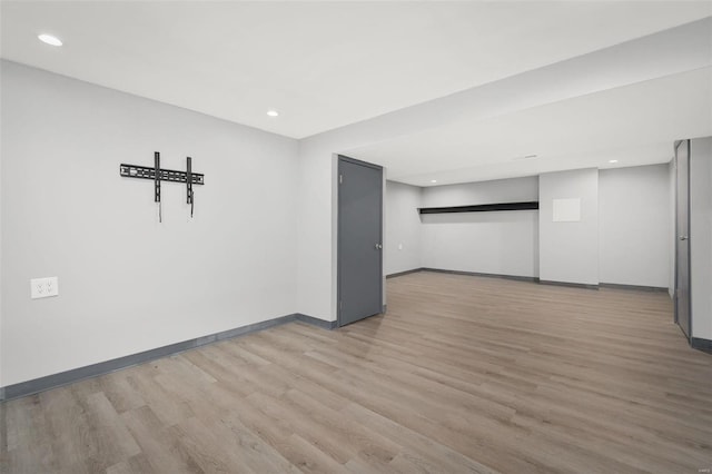 spare room featuring light hardwood / wood-style floors