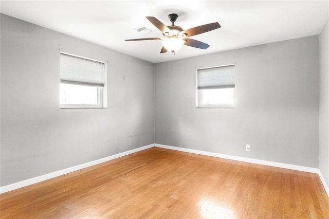 empty room featuring ceiling fan and light wood-type flooring