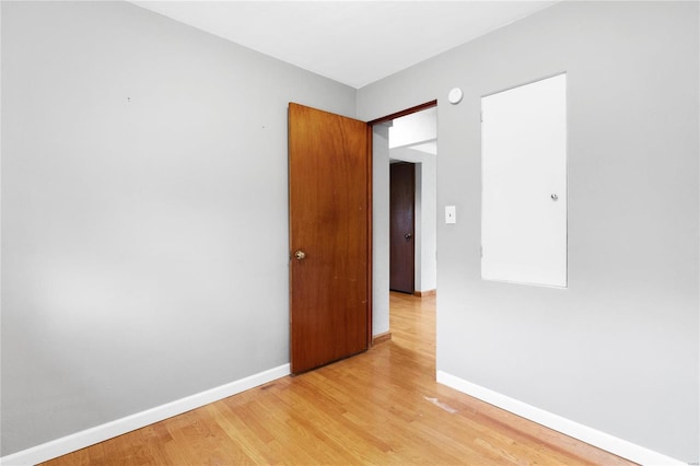 unfurnished room featuring light hardwood / wood-style floors