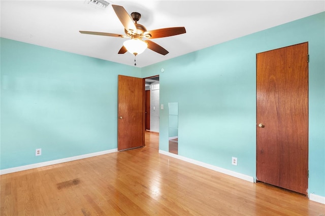 unfurnished bedroom featuring ceiling fan and light hardwood / wood-style floors