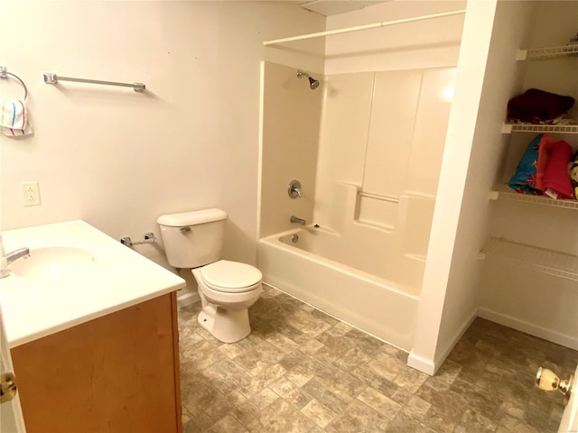 full bathroom featuring vanity, washtub / shower combination, and toilet