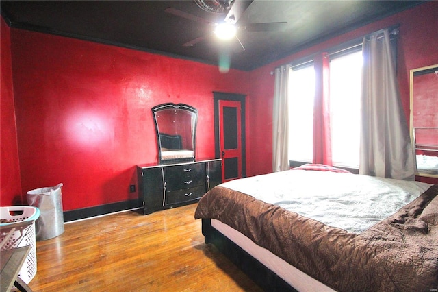 bedroom featuring hardwood / wood-style flooring and ceiling fan