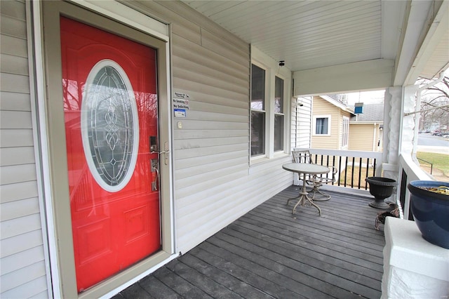 view of exterior entry with a porch