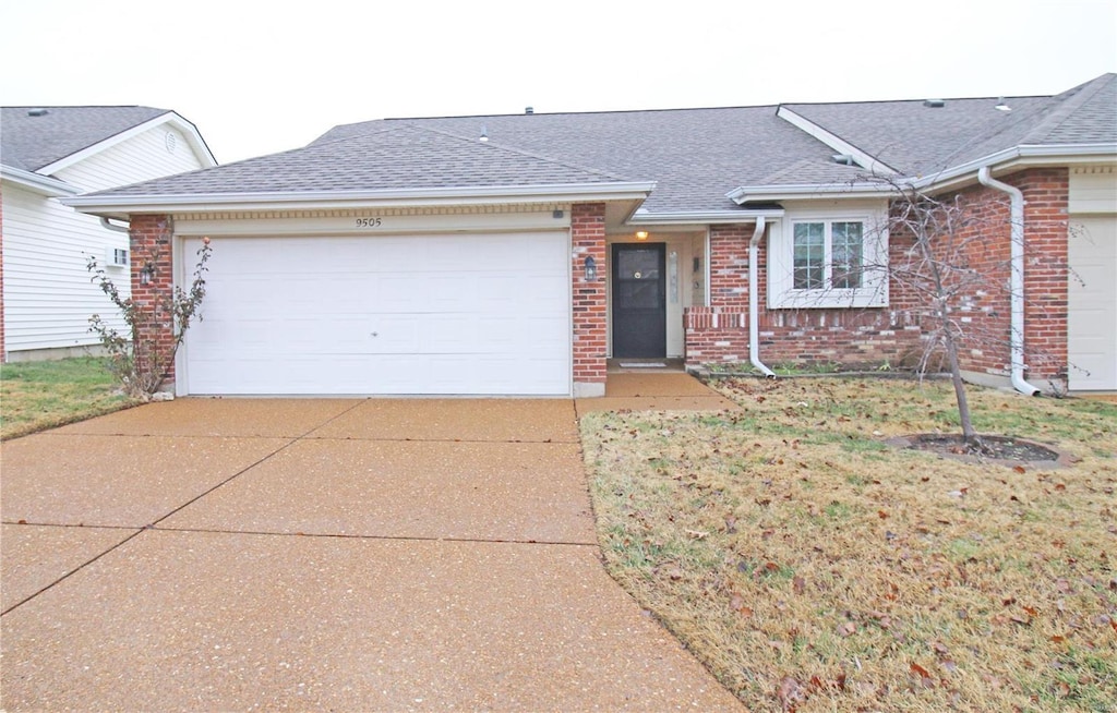 ranch-style house featuring a garage