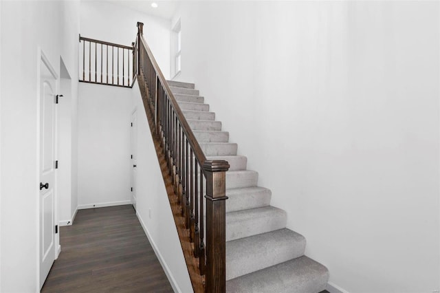 stairs with hardwood / wood-style flooring