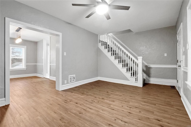 interior space with ceiling fan and hardwood / wood-style floors