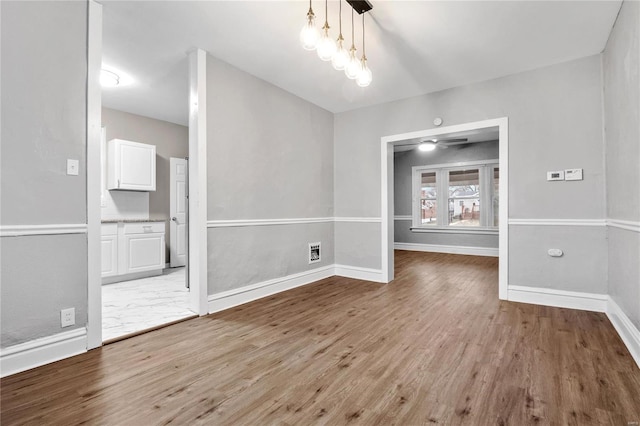 unfurnished dining area with light wood-type flooring