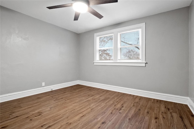 unfurnished room with ceiling fan and wood-type flooring