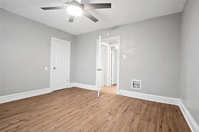 spare room with ceiling fan and light hardwood / wood-style flooring