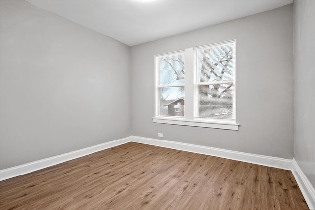 spare room with light wood-type flooring