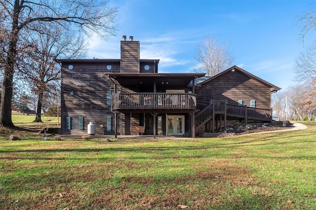 back of house featuring a yard and a deck