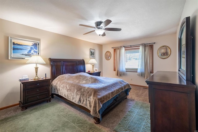 carpeted bedroom featuring a textured ceiling and ceiling fan