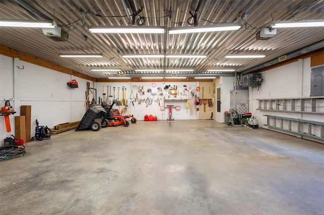 garage featuring a workshop area and a garage door opener