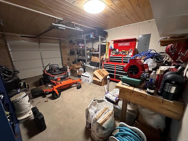 garage featuring electric panel, a garage door opener, and wooden ceiling