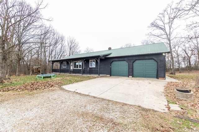 single story home with a porch and a garage