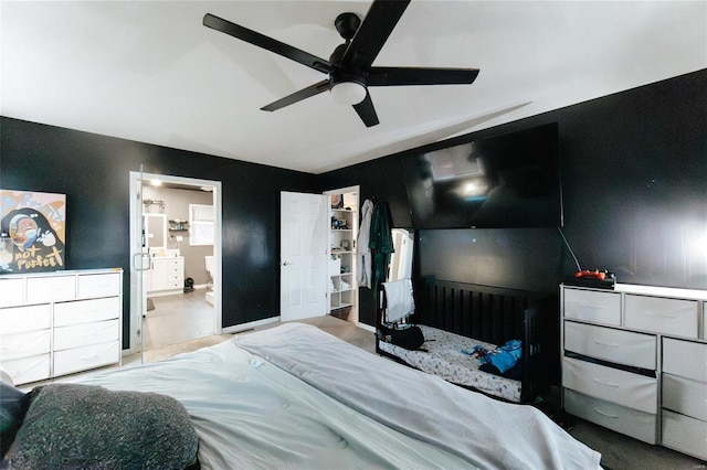 bedroom featuring ceiling fan and ensuite bathroom