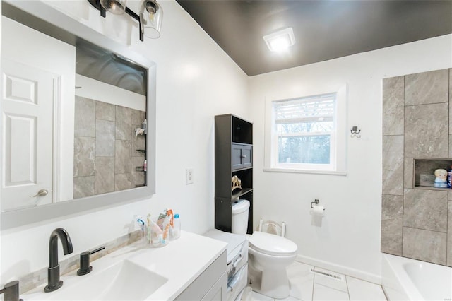 full bathroom with vanity, toilet, and tiled shower / bath