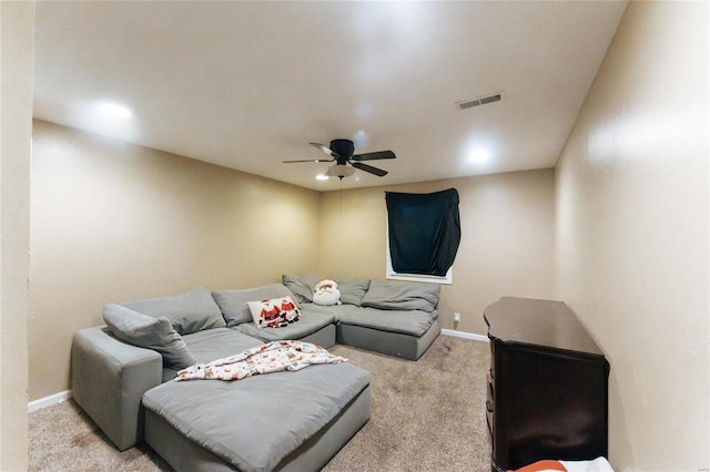 carpeted living room featuring ceiling fan