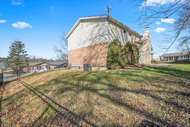 view of home's exterior featuring a lawn