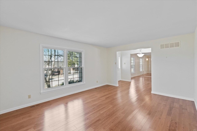 unfurnished room featuring light hardwood / wood-style floors