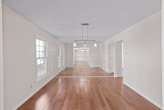 unfurnished dining area with hardwood / wood-style floors