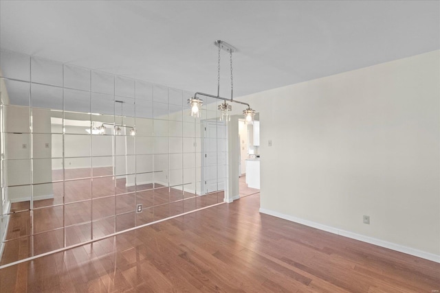 unfurnished dining area with dark hardwood / wood-style floors