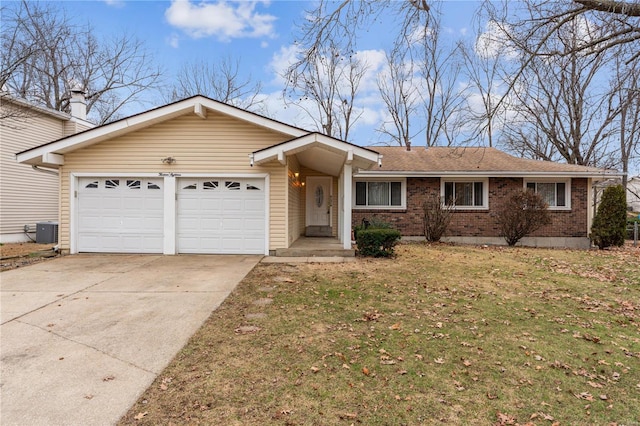 single story home featuring cooling unit, a garage, and a front yard