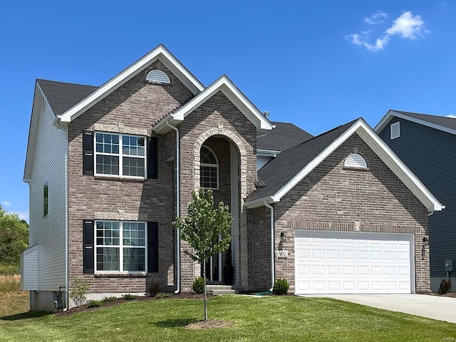 view of front facade with a front yard and a garage