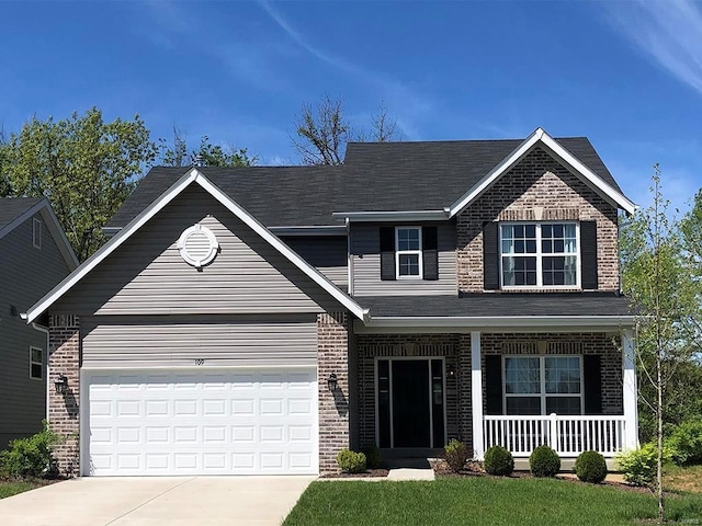 view of front of house with a garage and covered porch