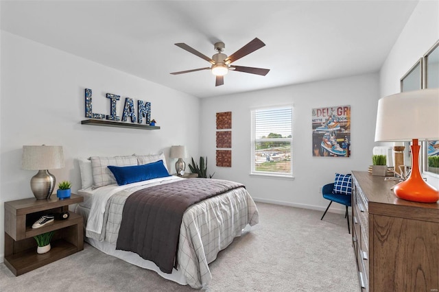 carpeted bedroom with ceiling fan