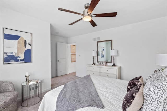 bedroom featuring light colored carpet and ceiling fan