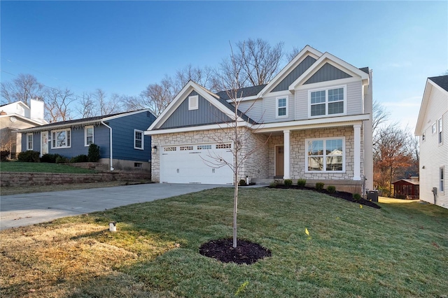 craftsman-style house featuring a front yard and a garage