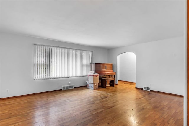 spare room featuring hardwood / wood-style flooring